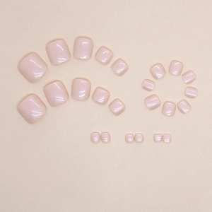 Glossy light pink press-on toenails set in various sizes for a professional pedicure look