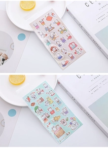 Close-up of 3D puffy cartoon stickers featuring sheep and rabbits in clear packaging