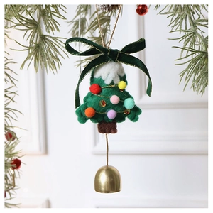 Detail of wool felt Christmas tree ornament with colorful pom-poms and golden bell