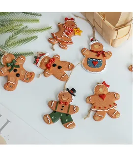 Close-up of six unique resin gingerbread man ornaments with festive hand-painted details