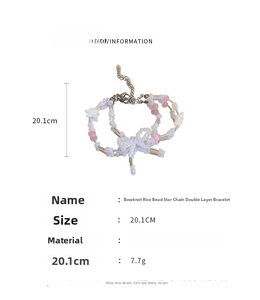 Detail view of double-layer beaded bracelet with star and bow charms, length 20.1cm