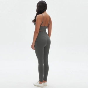 Detail view of charcoal gray seamless sports bra and high-waisted yoga leggings set