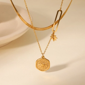 Gold double-layered stainless steel necklace with star pendant and snake chain