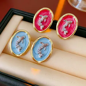Vintage enamel goldfish earrings with pearls in red and blue in a jewelry display box