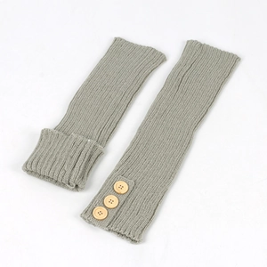 Winter warm grey knitted leg warmers with wood buttons and ribbed texture for boots