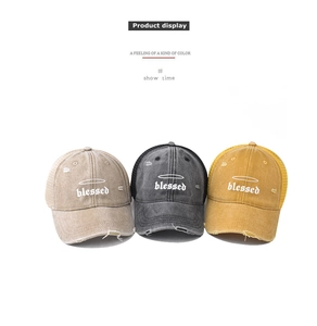 Detailed view of three vintage mesh baseball caps featuring blessed embroidery in 3 colors