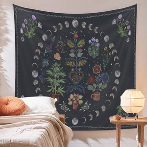 Detail of bohemian tapestry featuring botanical flowers and moon phase as bedroom decor
