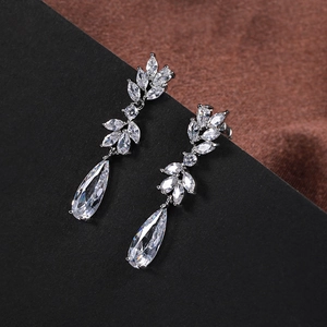Macro detail of silver drop earrings featuring marquise and pear shaped cubic zirconia