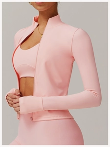 Detail of pink sports jacket with thumbhole cuffs and high-elastic yoga fabric material