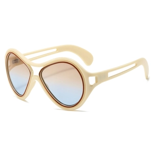 Vintage oversized sunglasses with cream frames, gradient lenses, and cutout temples
