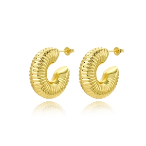 Detailed macro view of 18k gold plated hollow hoop earrings with spiral ribbed texture