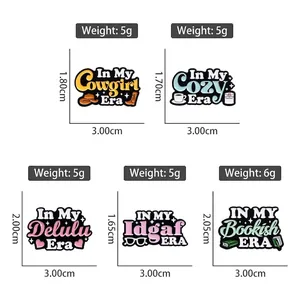 Five colorful enamel pins featuring Cowgirl and Bookish slogans on a white background