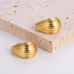 Water drop gold plated stainless steel earrings with shell texture on stone pedestal
