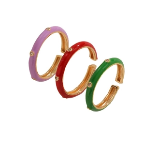 Three colorful enamel zircon rings in purple red and green on gold plated metal