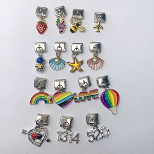 Macro view of assorted Italian style charms with colorful enamel and crystal accents