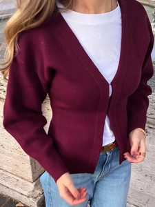 Detail of a burgundy long-sleeve knit cardigan for women with a V-neckline