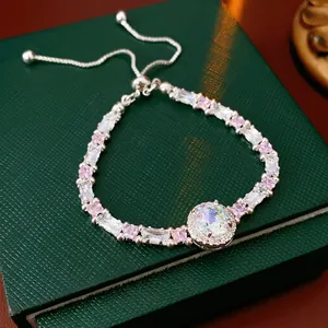 Silver adjustable bracelet with pink and white zircon stones on green leather box