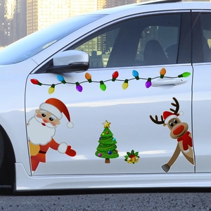 Detailed Christmas magnets featuring Santa and reindeer on a white car door surface