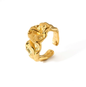 Detailed close-up of golden lava style open ring with irregular crumpled texture