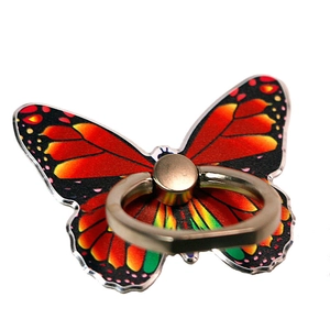 Close-up of colorful butterfly phone ring holder with red and yellow gradient metal texture