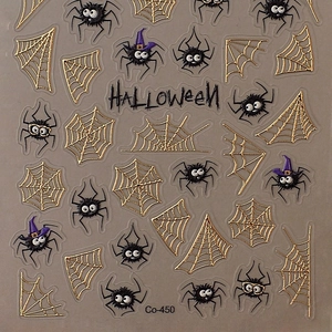 3D Halloween nail art stickers with metallic gold spider webs and cute black spiders