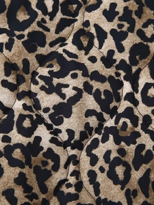Macro view of leopard print quilted fabric on this vintage style winter jacket