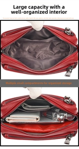Detail view of red leather crossbody bag with multiple interior compartments and storage