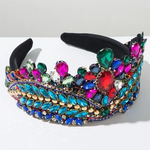 Close-up of colorful rhinestones and gold beads on a luxury velvet crown headband