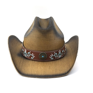 Detail of western cowboy straw hat featuring blue floral embroidery and turquoise bead