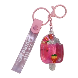 Pink liquid quicksand fruit popsicle keychain charm with motivational wrist strap