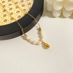 Elegant gold stainless steel necklace with pearl beads and a teardrop pendant