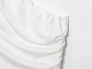 Detail shot of white high-elastic knit fabric featuring intricate pleated texture design