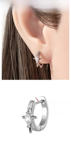 Macro detail of 316L surgical steel star hoop earring with inlaid zircon and 8mm inner diameter