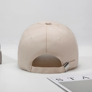 Rear view of beige cotton baseball cap featuring an adjustable metal buckle closure