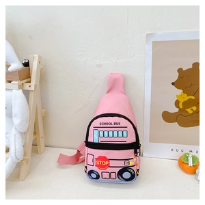 Detailed view of pink school bus shape kids chest bag in a cozy playroom setting