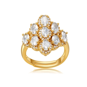 Macro shot of gold adjustable ring featuring nine oval cut cubic zirconia in a cluster
