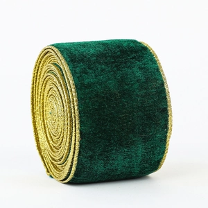 Dark green velvet Christmas ribbon with gold edges on a roll for tree decoration
