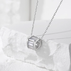 Elegant S925 silver necklace with a cylindrical pavé cubic zirconia pendant on white rock
