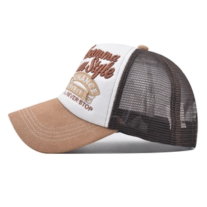 Detail of 3D embroidery on a mesh trucker hat with brown suede brim and white panels