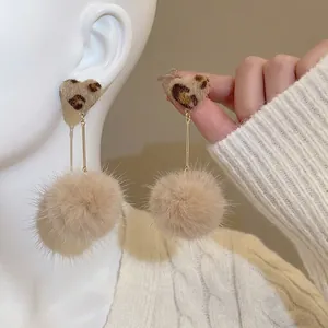 Leopard print heart earrings with plush fur balls and gold studs for women