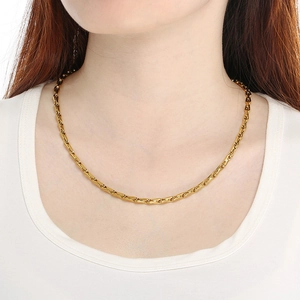 Fashionable gold stainless steel link necklace for men and women on a white background