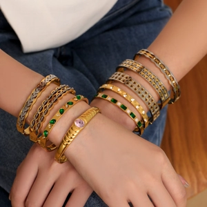 Chic 18k gold plated stainless steel bracelets with emerald and pink gemstones on wrist