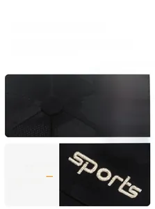 Detailed close-up of sports embroidery and stitching on the black camouflage baseball cap