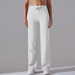 Detail of high-waisted wide-leg yoga pants featuring a drawstring and elastic waistband