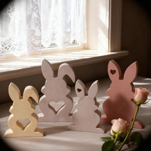 Set of four minimalist rabbit figurines with heart cutouts for Easter home decor