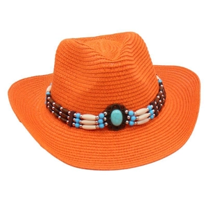 Detailed view of orange straw cowboy hat with ethnic beaded band and turquoise stone