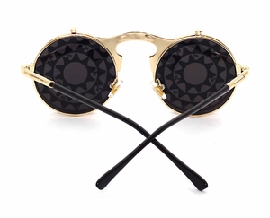 Steampunk flip-up sunglasses with golden gear-rimmed round frames and dark lenses