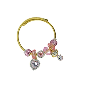 Gold coiled charm bracelet with pink heart crystal and sparkling pavé star accents