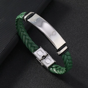 Detailed macro of green braided leather bracelet with stainless steel clasp and plate