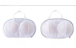 Detail of oval bra laundry bags with blue and grey piping and fine mesh fabric